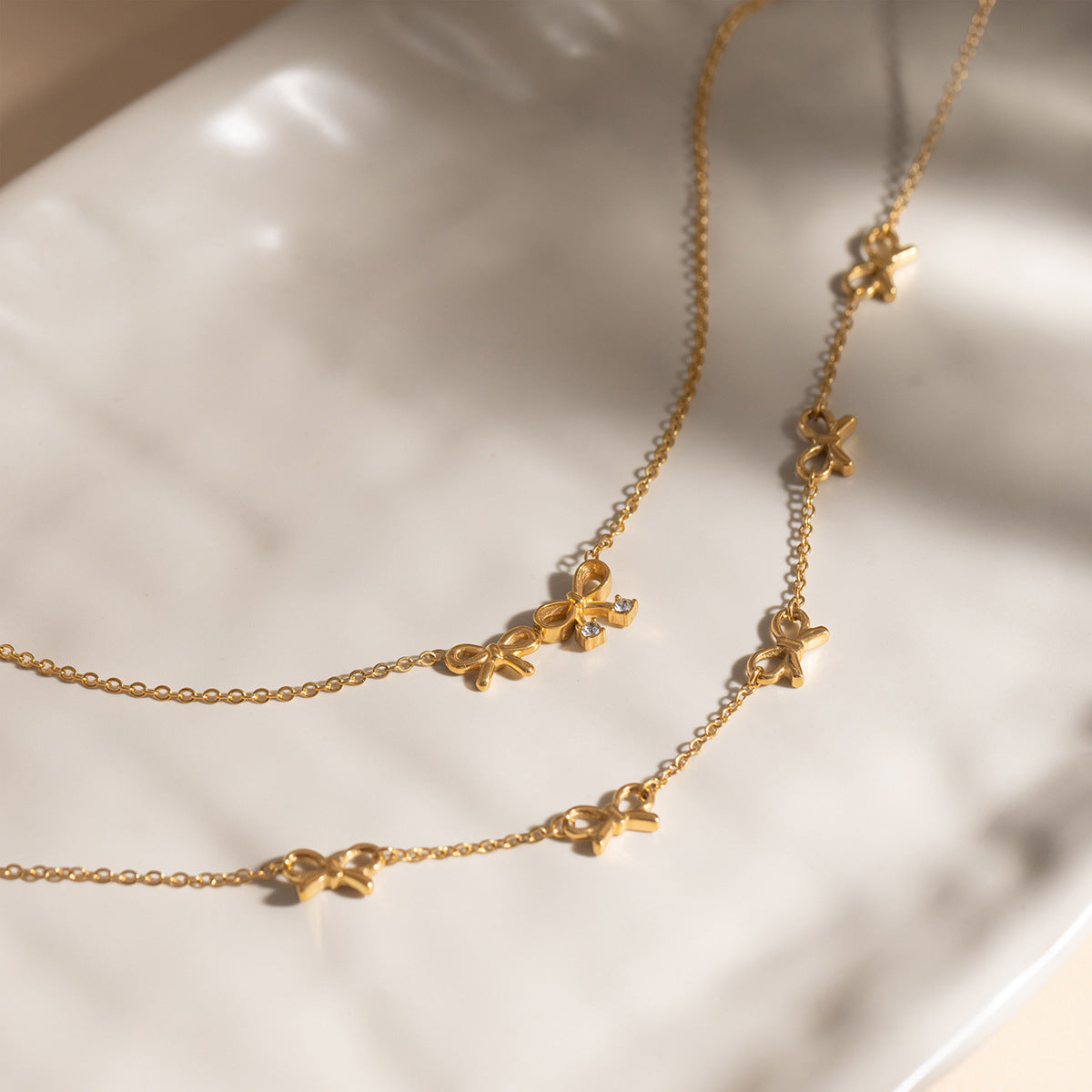 B廠 歐美款蝴蝶結吊墜鈦鋼鍍18K金項鍊批發 折扣@洽客服 26.03.W2「JDN0212209 JDN0212210 」