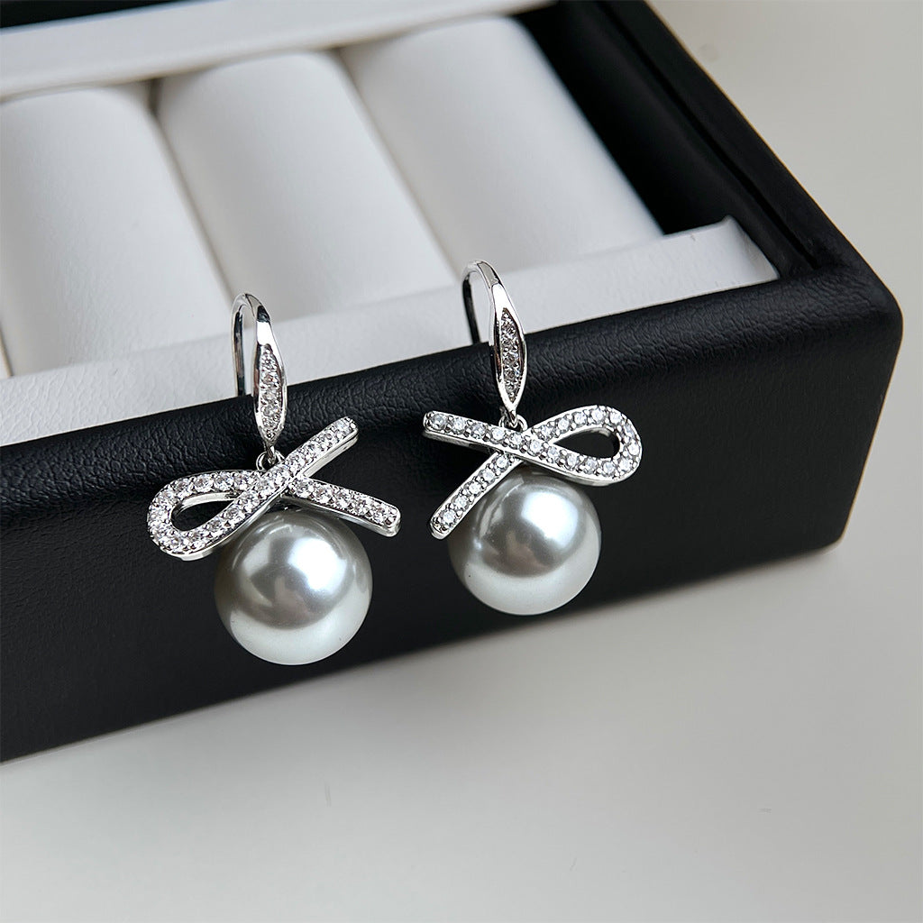 A廠 銅鍍白K｜日韓款輕奢鋯石蝴蝶結灰珍珠銀針耳環 批發 折扣@洽客服 26.02.W3「3969」